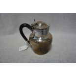 A SILVER HOT WATER POT, by Atkin Brothers, Sheffield, 1912, circular form, hinged cover, scroll
