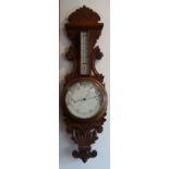 A LATE VICTORIAN OAK BANJO BAROMETER