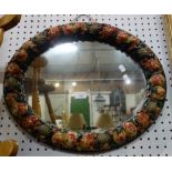 A MOULDED AND PAINTED GESSO OVAL MIRROR, in the form of a garland of exotic fruit, 55cm wide
