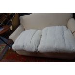 A TWO SEATER SOFA of traditional design, upholstered in Calico