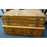 A MID 20TH CENTURY PALE OAK PLAN CHEST, 146cm wide and another similar, 153cm wide