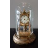 AN EDWARDIAN ANNIVERSARY CLOCK under a glass dome, dated 1903