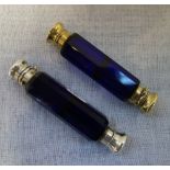 A BLUE GLASS DOUBLE ENDED PERFUME PHIAL, with gilt monogrammed lids and one other similar (2)