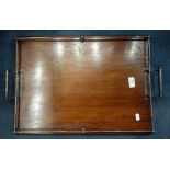 A MAHOGANY TRAY, with silver plated handles and gallery, 57.5cm wide
