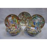 A PAIR OF CHINESE CANTONESE BOWLS AND COVERS decorated with figures in traditional costume and three