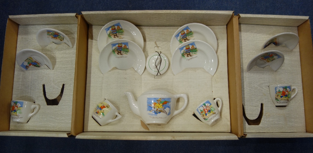 A VINTAGE CHILD'S TEASET, depicting nursery rhymes, including 'Old Mother Goose' with original box