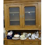 A CONTINENTAL STRIPPED PINE DRESSER, the base fitted with cupboards and drawers, the top with