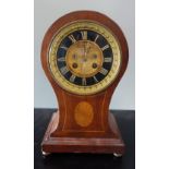 AN EDWARDIAN BALLOON CLOCK with a mahogany case, 30cm high