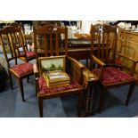 A SET OF SIX 1920'S OAK DINING CHAIRS, comprising two carvers and four side chairs with drop-in