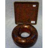 A RED LACQUER CONTAINER decorated with gilt foliage, of doughnut form and a small square tray (2)