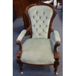 A VICTORIAN WALNUT SHOW FRAME ARMCHAIR, with button velvet upholstery