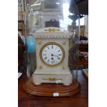 A 19TH CENTURY WHITE ALABASTER CASED MANTEL CLOCK, with gilt metal fittings and white enamel face,