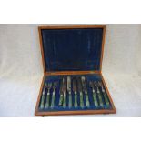A SET OF SIX FISH KNIVES AND FORKS in fitted wooden presentation case