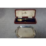 A SILVER-GILT CASED 1937 CORONATION SPOON, and a small contemporary silver twin handled pin tray,