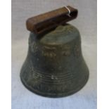 A BRASS BELL with symbols of St Luke and St James
