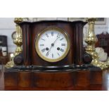 A VICTORIAN MANTEL CLOCK in a walnut and ebonised case, 21.5cm high