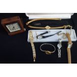 A COLLECTION OF WRISTWATCHES and a travelling clock