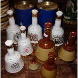 A COLLECTION OF BELL'S SCOTCH WHISKY commemorative bottles by Wade, mostly with contents