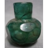 AN ANCIENT ISLAMIC GREEN FACETED VASE, circa 10th/11th century, 9cm high