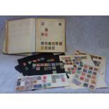 AN EARLY 20TH CENTURY STAMP ALBUM, containing penny reds, twopenny blues and other world stamps to