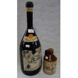 A LARGE BOTTLE OF VINTAGE ITALIAN WINE, 'Vino Barbera' circa 1970s and a small flagon of Olde