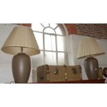 A PAIR OF CONTEMPORARY BROWN CERAMIC TABLE LAMPS, with cream pleated shades