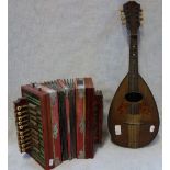 AN EARLY 20TH CENTURY ACCORDIAN and a mandolin labelled "Pietro Jonelli Napoli"