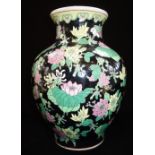 FAMILLE NOIRE BALUSTER VASE, the sides decorated with blossoming stems, 28cm high