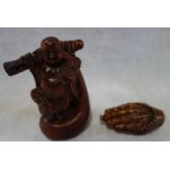 A CHINESE CARVED BOXWOOD STUDY OF BUDDHA, 10cm high and a similar carved study of praying hands with