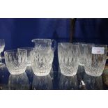 FOUR WATERFORD TUMBLERS, six taller Waterford tumblers and a similar glass water jug