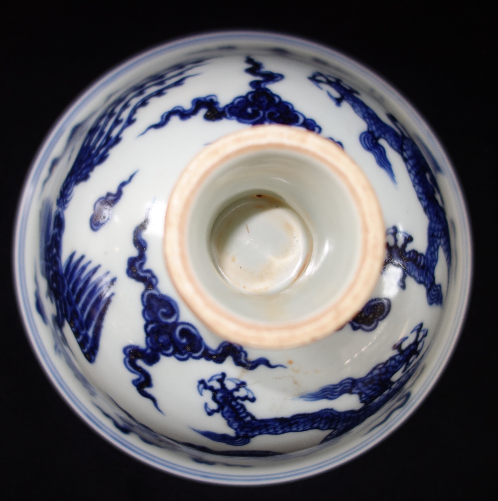 MING STYLE BLUE AND WHITE STEM CUP, the sides decorated with a dragon and phoenix, apocryphal Xuande - Image 2 of 2