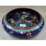 A BLUE GROUND CLOISONNE BOWL decorated with flowers and foliage, 25.5cm dia.