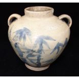 MING GLAZED POTTERY JAR the baluster sides decorated with leafy bamboo, 12cm high