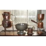 A TUDRIC HAMMERED PEWTER FOOTED BOWL, 22cm diam, a copper jug on iron feet, a chamberstick and a