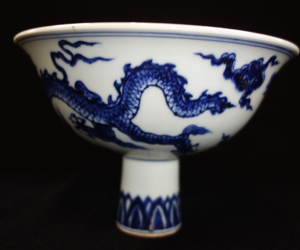 MING STYLE BLUE AND WHITE STEM CUP, the sides decorated with a dragon and phoenix, apocryphal Xuande