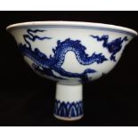 MING STYLE BLUE AND WHITE STEM CUP, the sides decorated with a dragon and phoenix, apocryphal Xuande