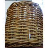 A LARGE WOVEN RATTAN LOG BASKET, 64cm high