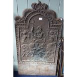A CHARLES II STYLE CAST IRON FIRE BACK, decorated with Poseidon and dolphins, 98.5cm high