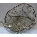 A PAIR OF VINTAGE WIRE POTATO BASKETS