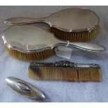 A PAIR OF SILVER BACKED HAIR BRUSHES, comb and nail buffer (4)