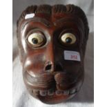 A TRIBAL HARDWOOD WALL MASK OF HANUMAN of South Indian or Sri Lankan origin, with inlaid eyes,