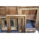 A 19TH CENTURY MOULDED AND GILT PICTURE FRAME and two reproduction gilt frames