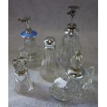 A COLLECTION OF PERFUME BOTTLES, one with a silver and enamelled lid