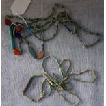 A STRING OF ANCIENT GLASS, CERAMIC AND STONE BEADS and others similar