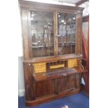 A REGENCY MAHOGANY SECRETAIRE BOOKCASE, with satinwood fitted interior, the upper section with old