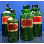 FOUR 19TH CENTURY GREEN GLASS APOTHECARY POISON BOTTLES, to include, 'Laudanum. Paregoric'