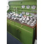 A GREEN PAINTED PINE KITCHEN DRESSER, with integral plate rack over three drawers and three