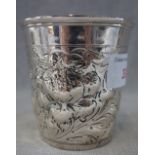 AN EMBOSSED SILVER BEAKER, 8.3cm high, approx 3.80oz