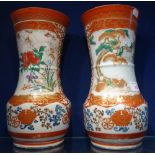 A PAIR OF LATE 19TH CENTURY JAPANESE KUTANI VASES of baluster form, decorated with fisherman below a