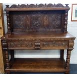 A VICTORIAN CARVED OAK BUFFET, with raised panelled back, an open pot board, 153cm wide